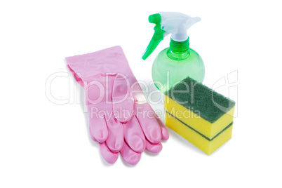 High angle view of sponge with spray bottle and glove