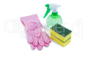 High angle view of sponge with spray bottle and glove