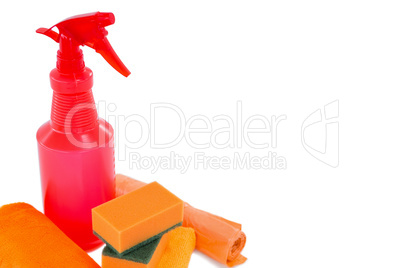 Close up of spray bottle with napkins and sponges