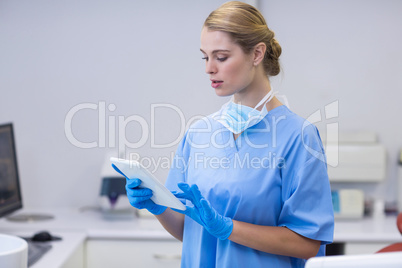 Female nurse using digital tablet