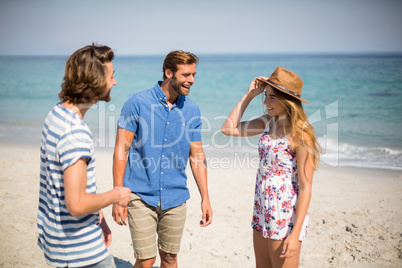 Friends standing at beach