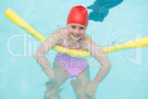Smiling girl swimming in the pool