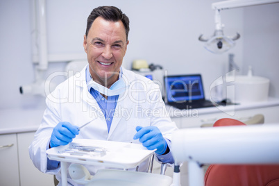 Portrait of smiling dentist