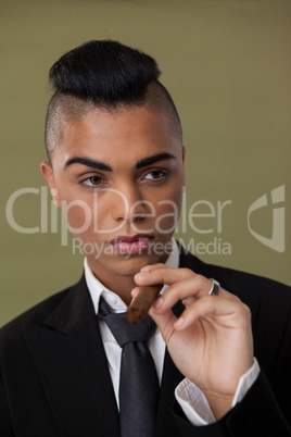 Close up of transgender woman holding cigarette