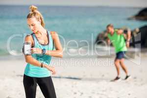 Woman using smartphone on armband