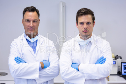 Portrait of dentists standing with arms crossed