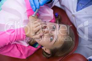 Young patient scared during a dental check-up