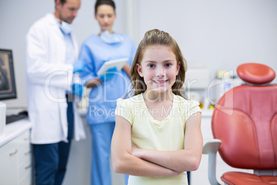 Portrait of young patient standing with arms crossed