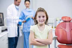 Portrait of young patient standing with arms crossed