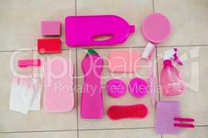 Overhead view of pink color cleaning equipment on floor