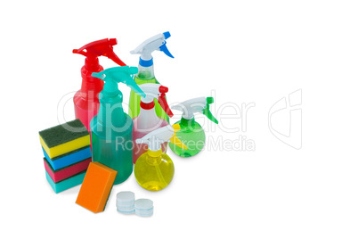 High angle view of colorful sponges and spray bottles