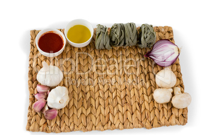 Overhead  view of vegetables with tagliatelle on place mat