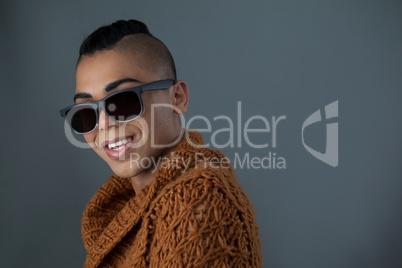 Portrait of smiling transgender woman wearing sunglasses