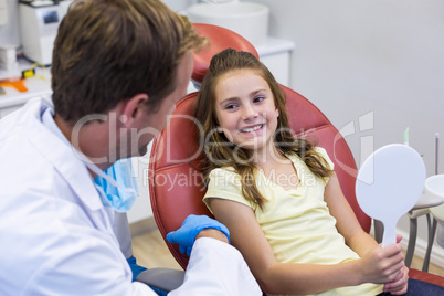 Young patient interacting with dentist in dental clinic