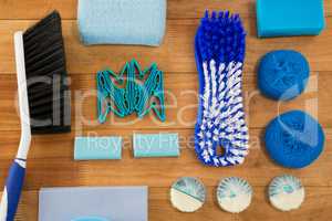 Overhead view of brushes and sponge with soaps