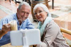 Senior couple taking selfie from mobile phone