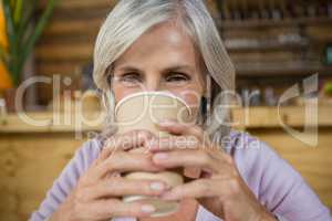 Portrait of senior woman having coffee