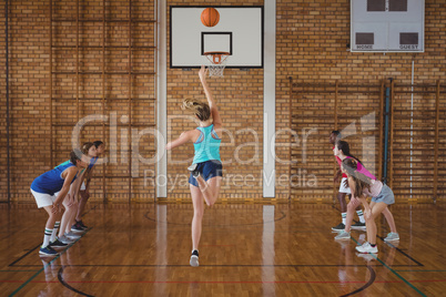Determined high school kids playing basketball
