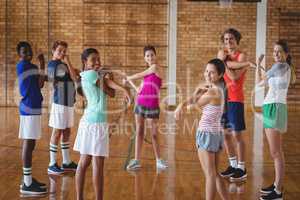 High school kids warming up in the court