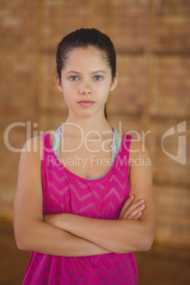 High school girl standing in basketball court