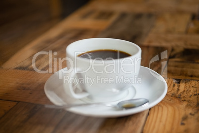 Close up of black coffee on wooden table