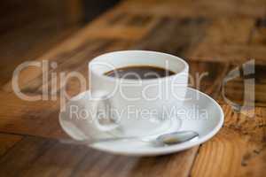 Close up of black coffee on wooden table