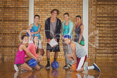 High school kids discussing game plan in the court