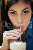 Close up of woman drinking cold coffee