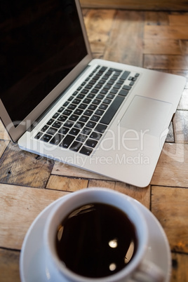 Close up of laptop and coffee