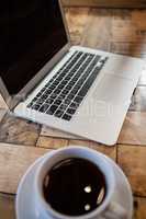 Close up of laptop and coffee