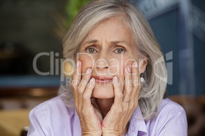 Close up portrait of worried senior woman