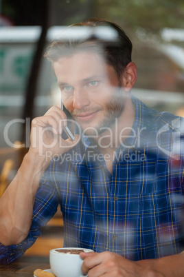 Handsome man talking on mobile phone