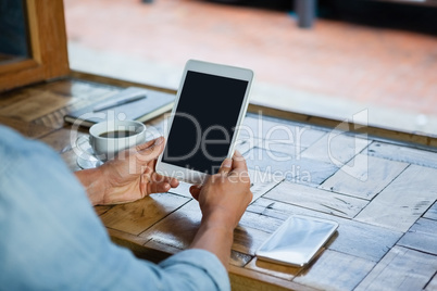 Cropped image of person holding mobile phone