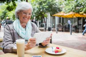 Senior woman using digital tablet