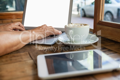 Close up of woman working on laptop computer