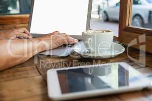 Close up of woman working on laptop computer