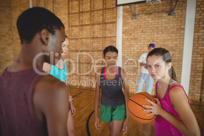 Concentrated high school kids playing basketball