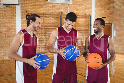 Basketball players interacting with each other in the court