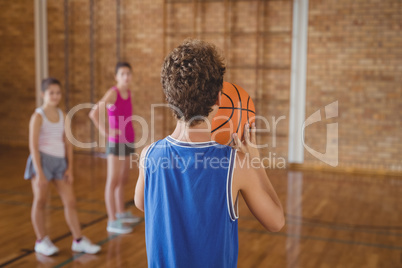 High school boy about to take a penalty shot while playing basketball