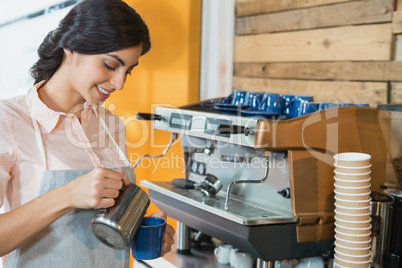 Waitress pouring coffee into cup
