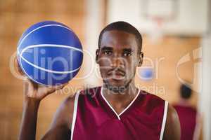 Determined basketball player holding a basketball