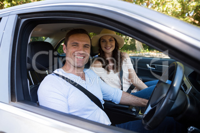 Young couple sitting in car