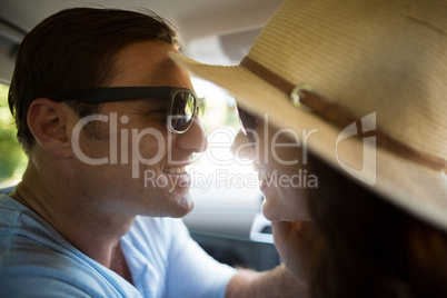 Romantic couple traveling in car