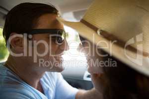 Romantic couple traveling in car