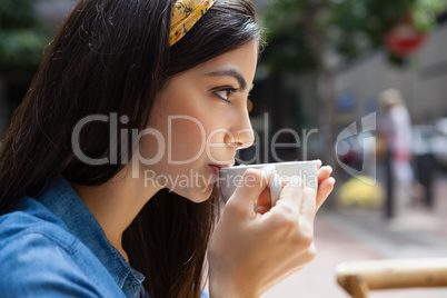 Close up of woman drinking coffee
