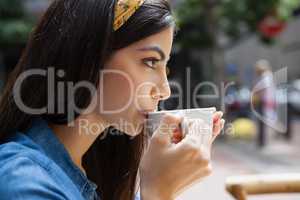 Close up of woman drinking coffee