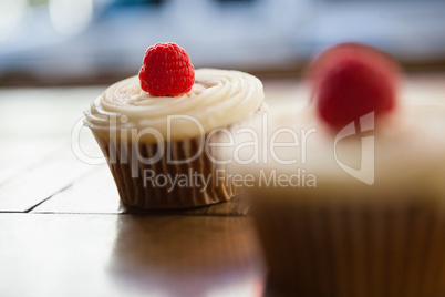 Close up of raspberry cupcakes on table