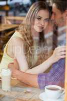 Close up of smiling couple sitting in cafe