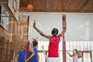 Determined high school kids playing basketball