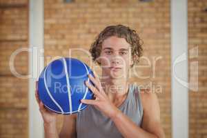 Determined boy holding a basketball